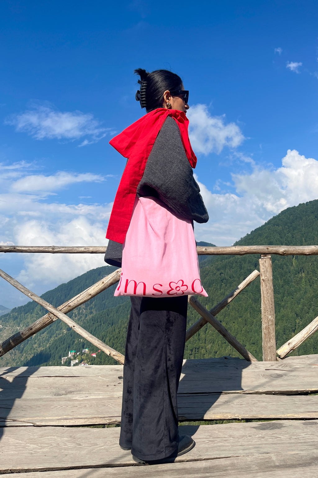 Tote bag with bow, red and pink colour, model showcasing tote bag